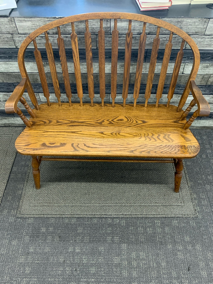 VTG DARK WOOD ROUND BACK BENCH.