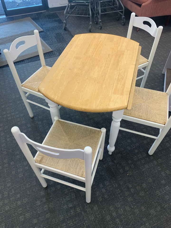 ROUND WHITE DINETTE BLONDE WOOD TOP W/ FOLDING SIDES AND 4 WHITE WICKER BOTTOM C