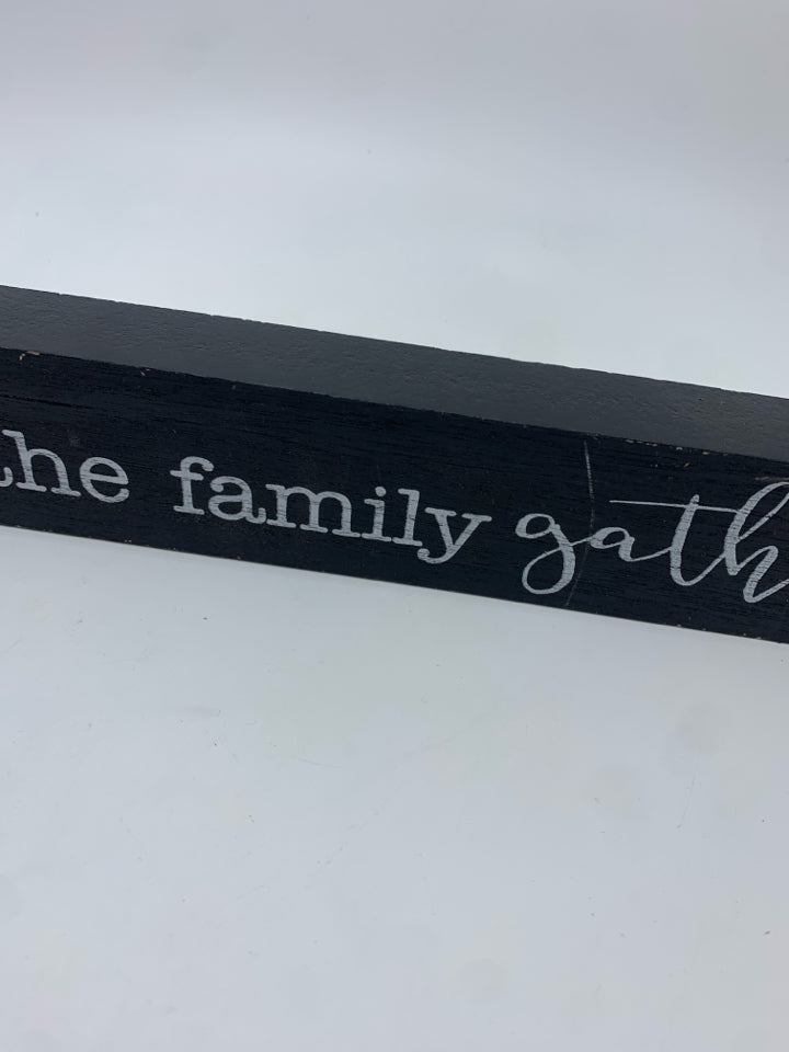 HOME IS WHERE THE FAMILY GATHERS WOOD BLOCK SIGN.