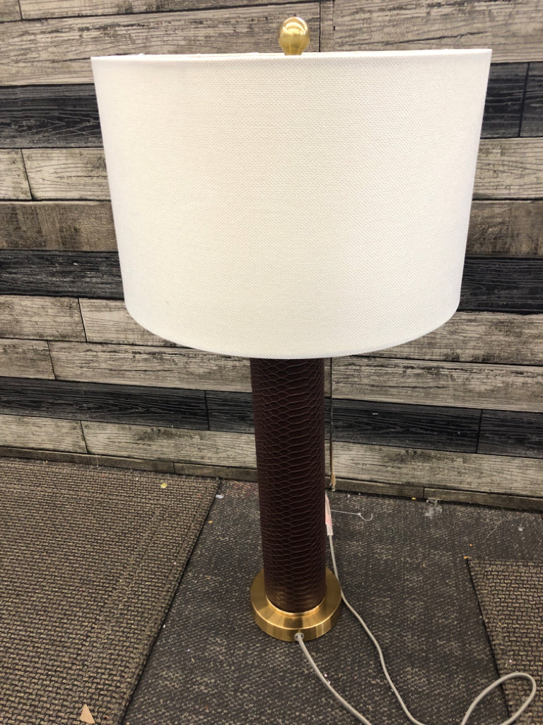 FAUX LEATHER GOLD BASE LAMP W/TAN SHADE.