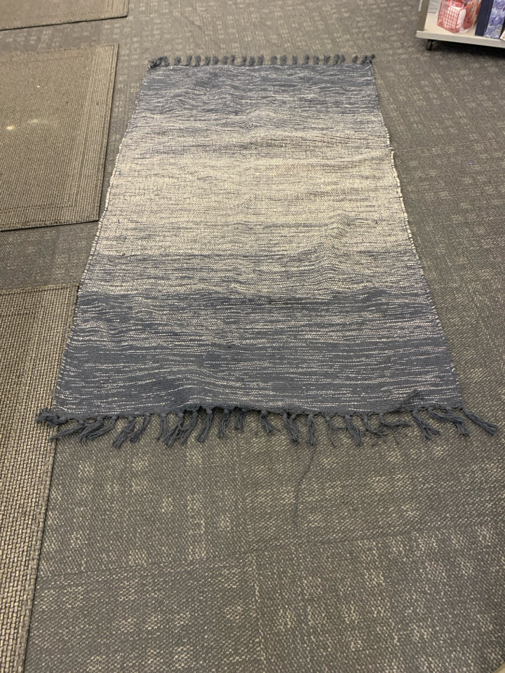 NAVY BLUE AND WHITE AREA RUG.