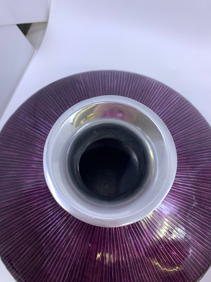 HEAVY METAL VASE W/ PURPLE GLAZE.