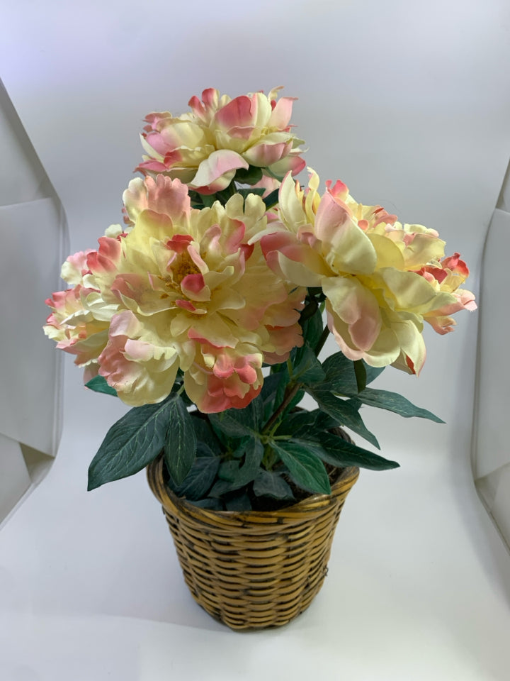 FAUX PINK FLOWER BOUQUET IN WOVEN BASKET.