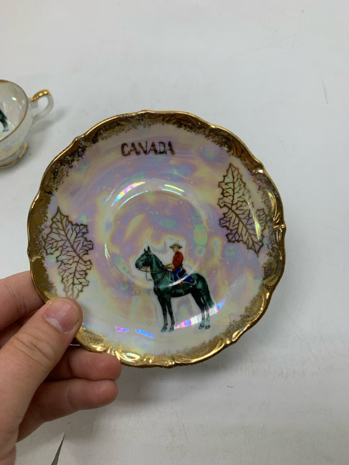 IRIDESCENT SMALL TEACUP W/ MAN RIDING HORSE.