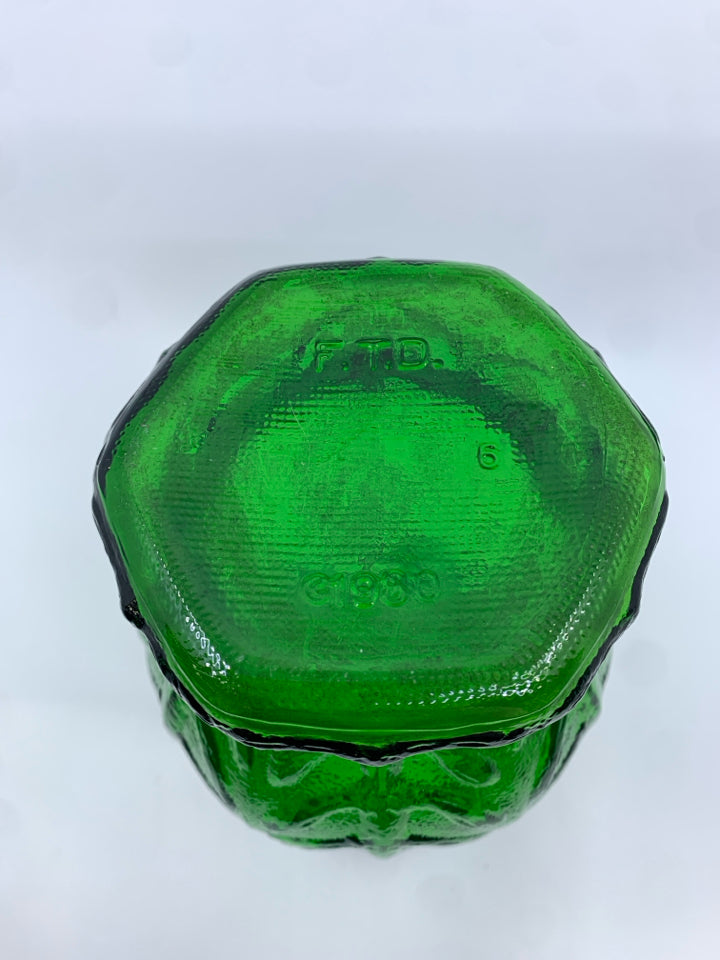 VTG GREEN GLASS FOOTED VASE W/ EMBOSSED LEAF PATTERN.