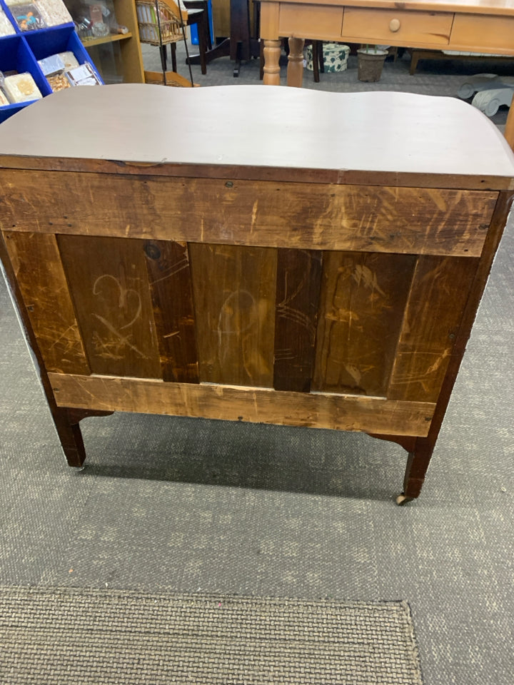 DISTRESSED DRESSER ON WHEELS.