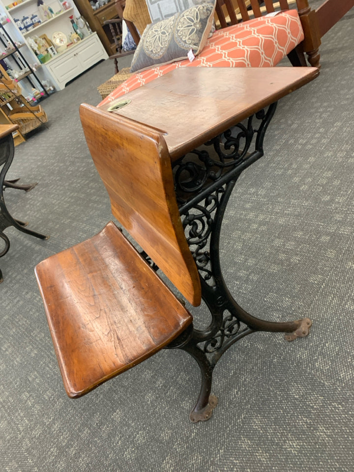 VTG DK WOOD SCHOOL DESK W/IRON SCROLL BASE.