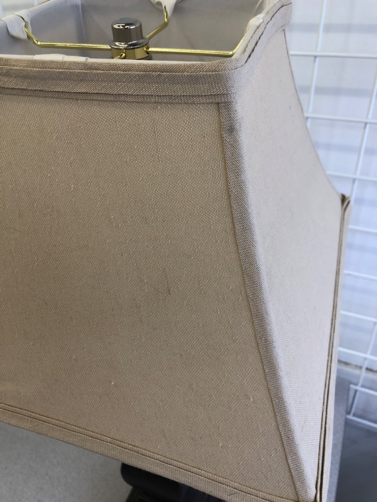 DARK WOOD BASE LAMP W/TAN FABRIC SHADE.