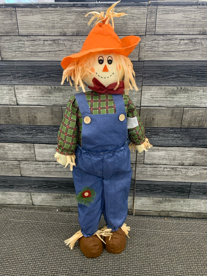 SCARECROW IN BLUE OVERALLS STANDING DECOR.