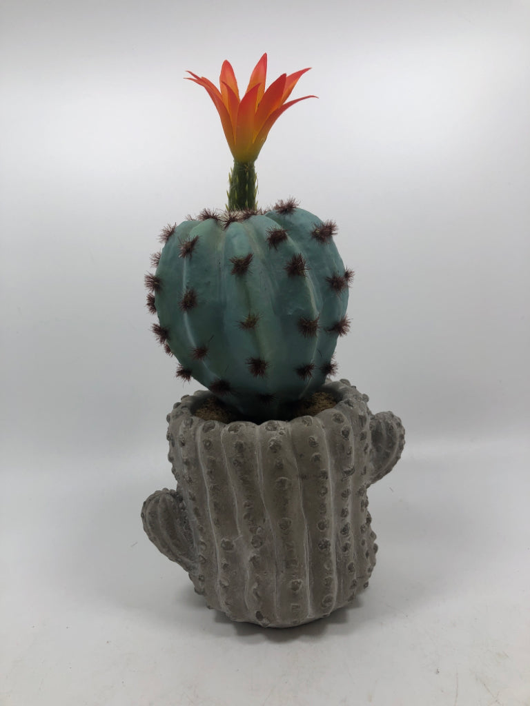 FAUX BLUE CACTUS IN CERAMIC CACTUS POT.
