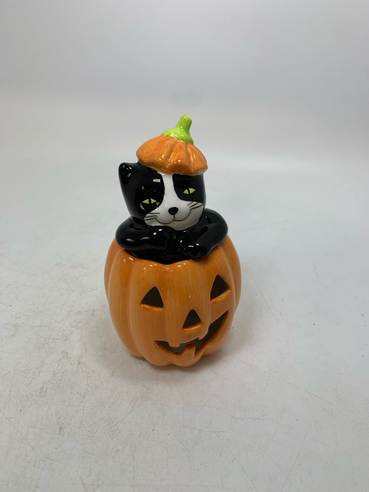 BLACK/WHITE CAT POPPING OUT OF JACKO LANTERN TEALIGHT HOLDER.
