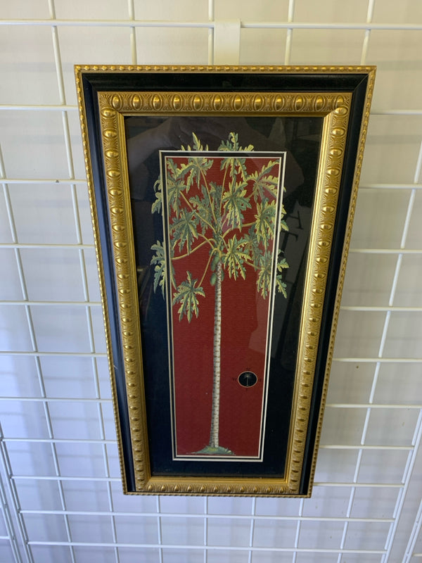 TREE IN BLACK AND GOLD FRAME.