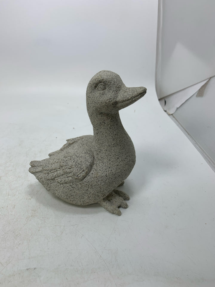 CEMENT DUCK W/ TEXTURED WING FEATHERS.