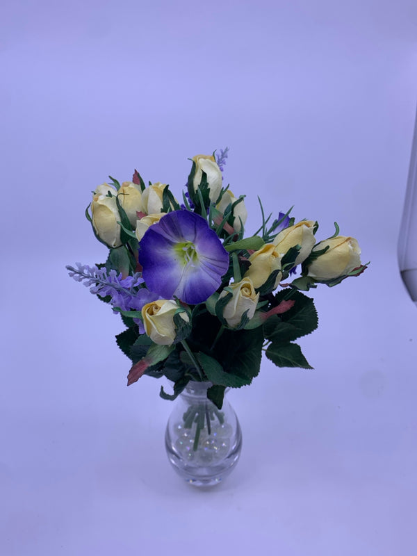 PURPLE AND YELLOW FLOWERS IN HOUR GLASS VASE.
