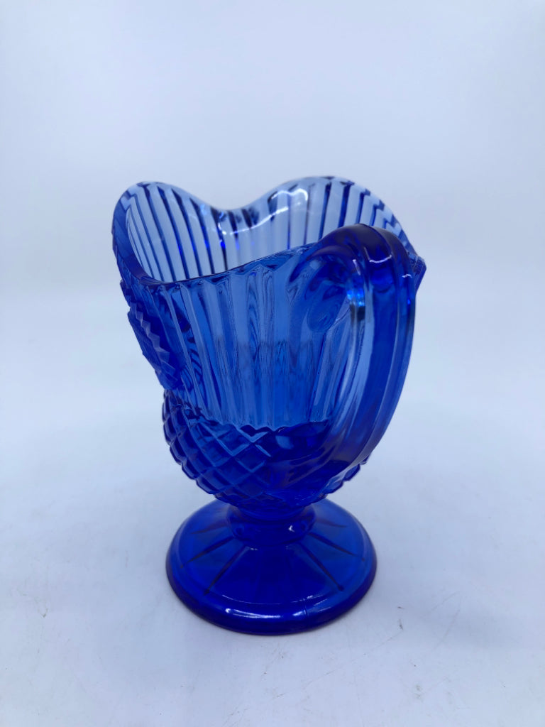 DARK BLUE GLASS FOOTED PITCHER RIBBED W/ EMBOSSED FROSTED HOUSE.