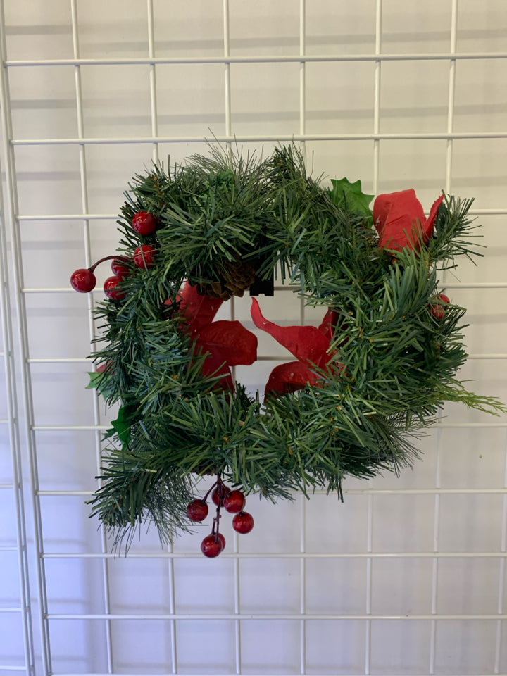 SMALL POINSETTIA W PINECONE WREATH.