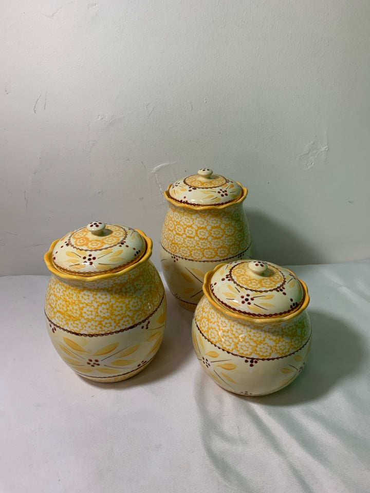 3 YELLOW PATTERN TEMPTATIONS CANISTERS.