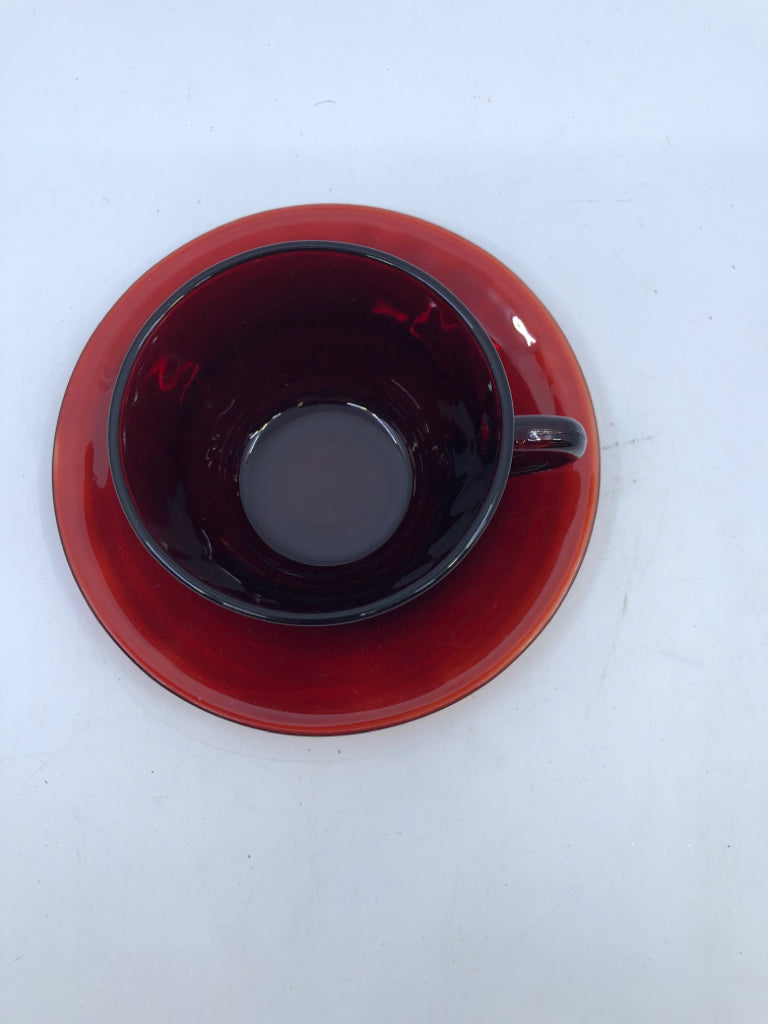 RED GLASS TEACUP AND SAUCER.