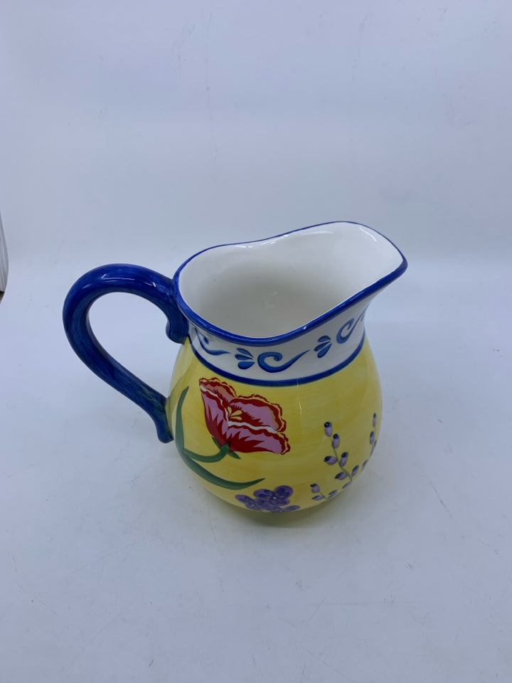 FLORAL BLUE HANDLE CERAMIC PITCHER.