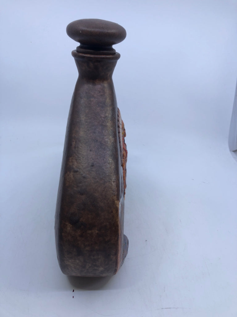 WIDE CERAMIC EMBOSSED INDIGENOUS MAN DECANTER W STOPPER.