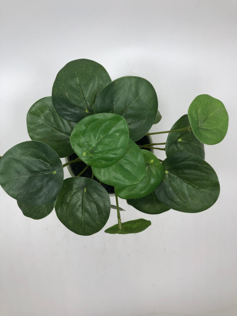 FAUX PLANT IN WHITE PLANTER.