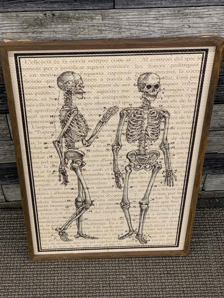 SKELETONS WOVEN PRINT IN WOOD FRAME.