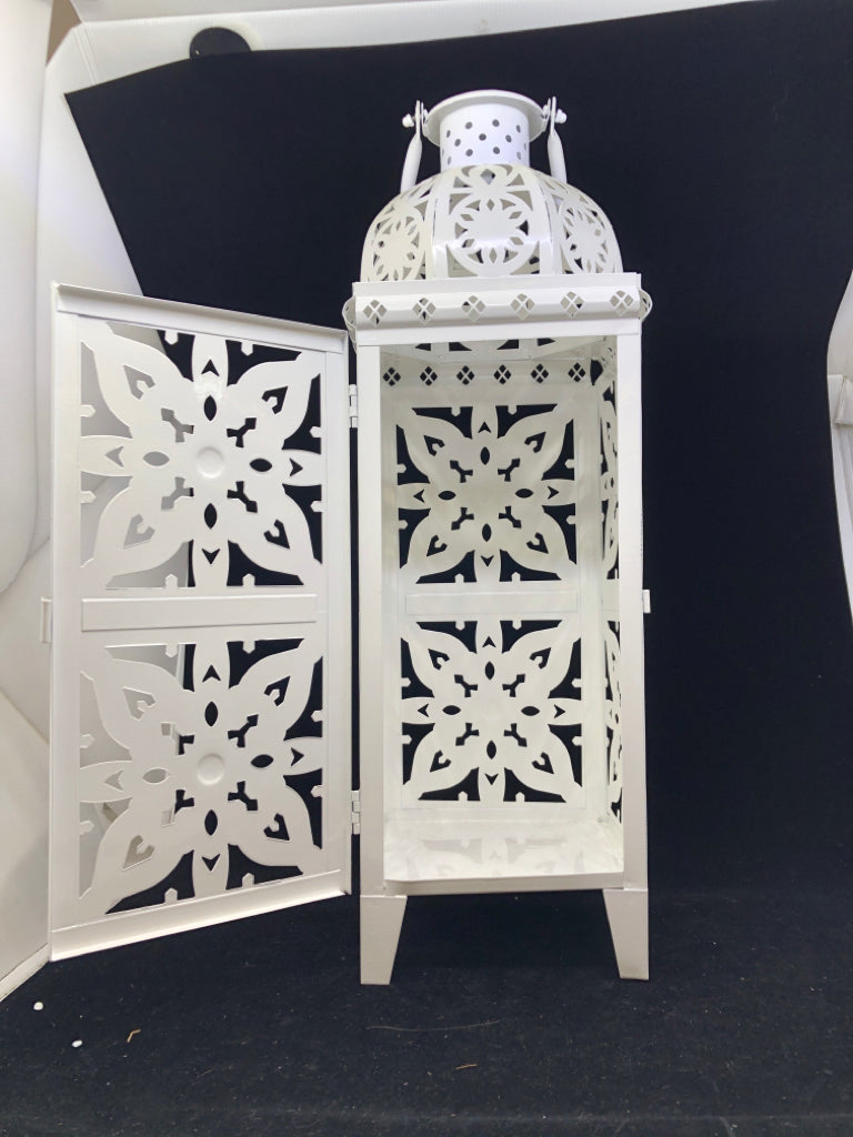 FOOTED WHITE PIERCED METAL LANTERN.