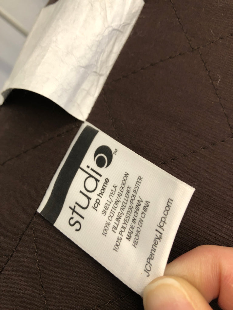 DARK BROWN ROUND BOLSTER PILLOW.