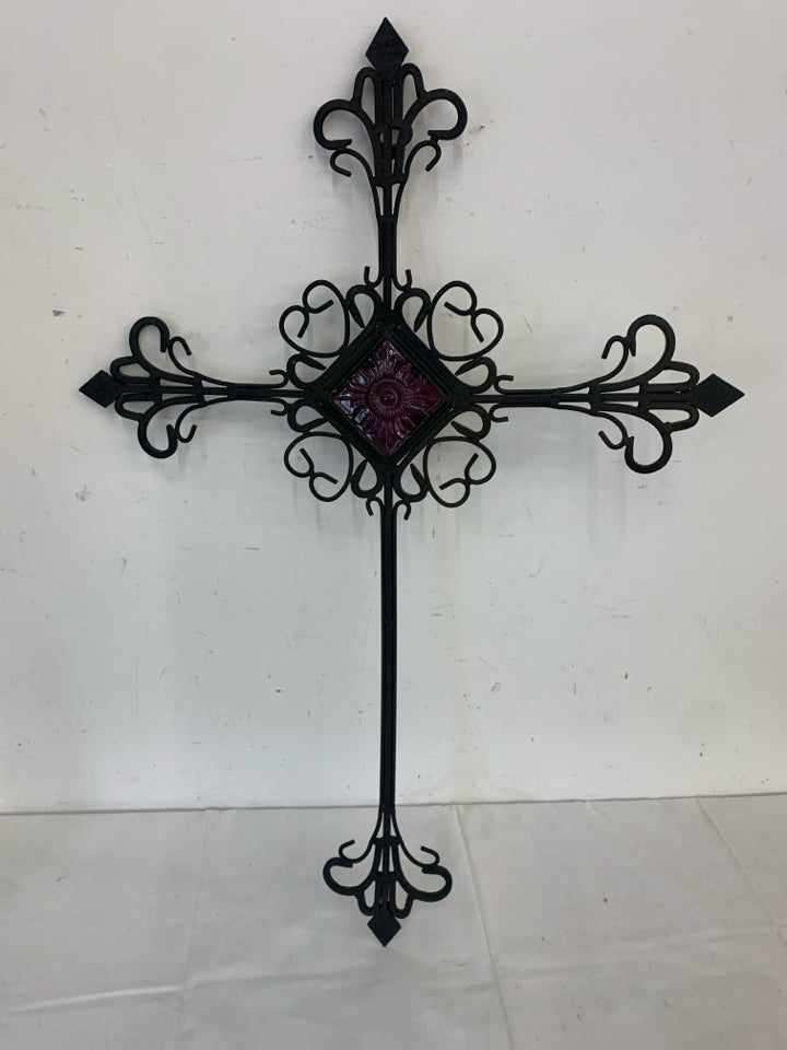 METAL SCROLL CROSS W/PURPLE GLASS IN MIDDLE.