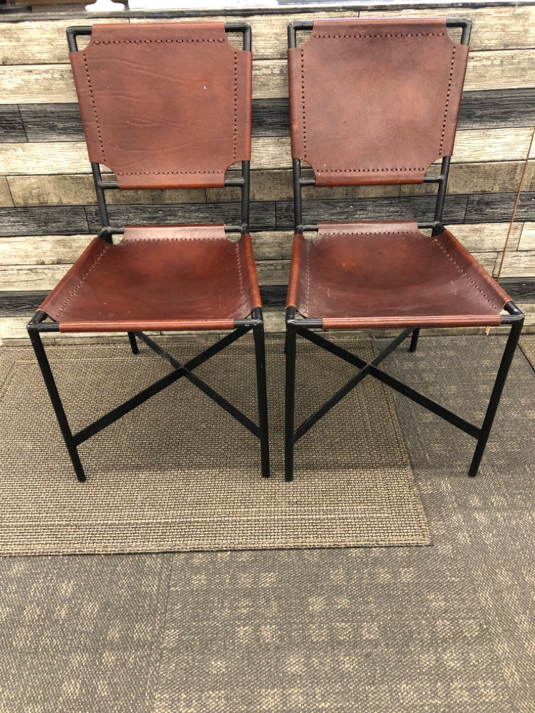 2 BROWN LEATHER CHAIRS CRATE & BARREL.