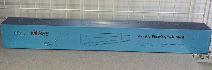 NIB ACRYLIC FLOATING WALL SHELF.