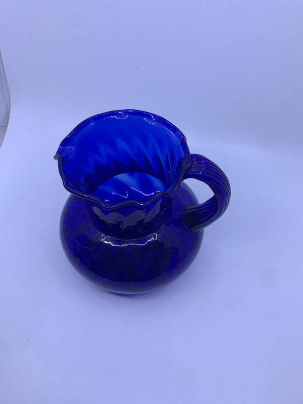 BLUE PITCHER WITH RIBBED HANDLE.