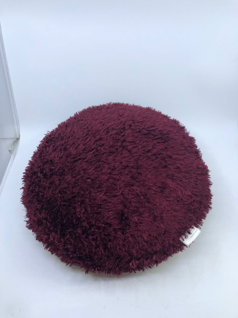 ROUND MAROON PILLOW.