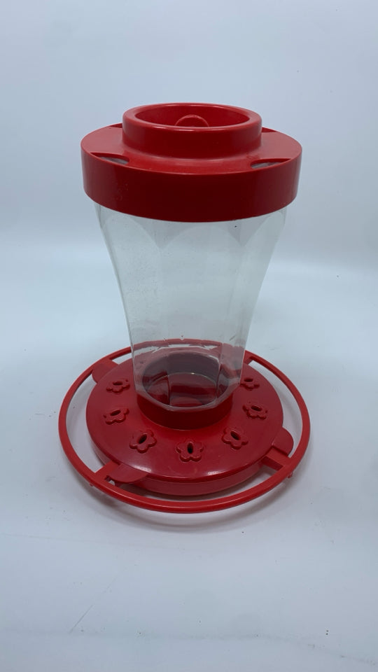 RED HUMMING BIRD FEEDER.