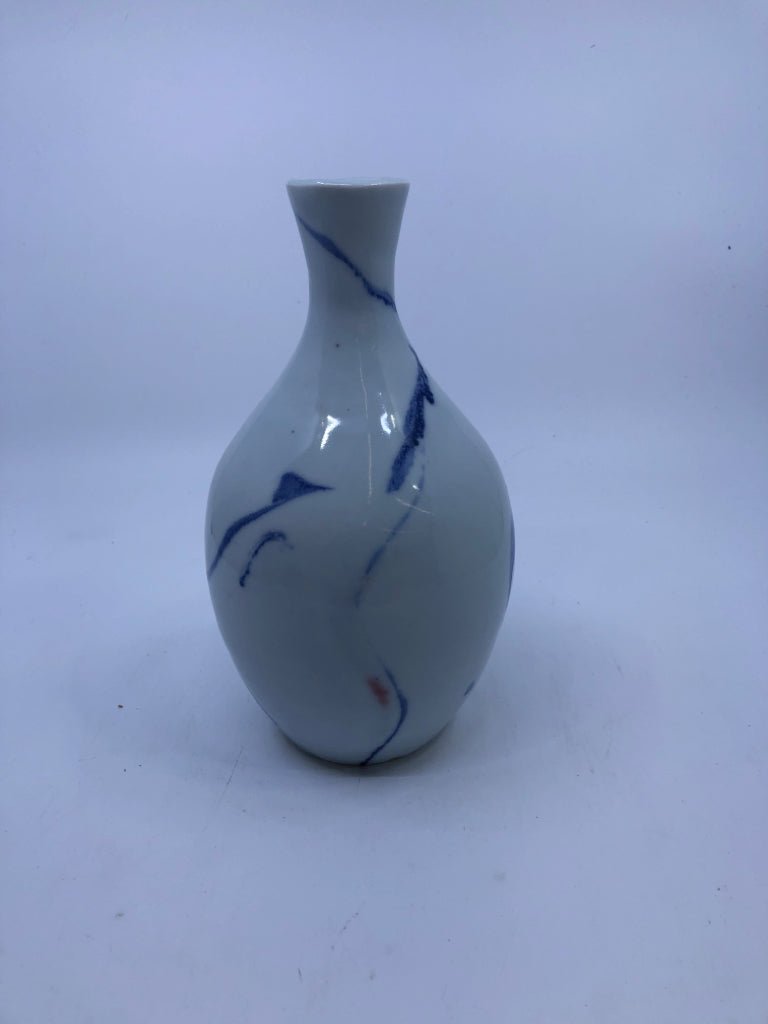 WHITE POTTERY VASE W/ BLUE DESIGNS.