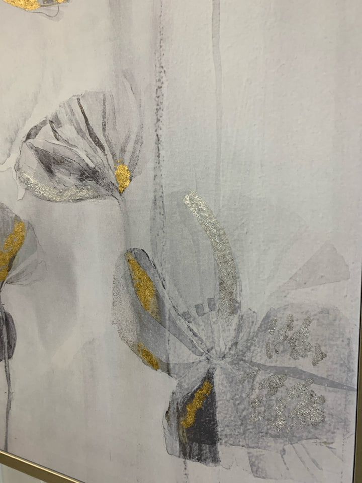 MANY B&W FLORALS ON FRAMED CANVAS W/GOLD DETAILS.