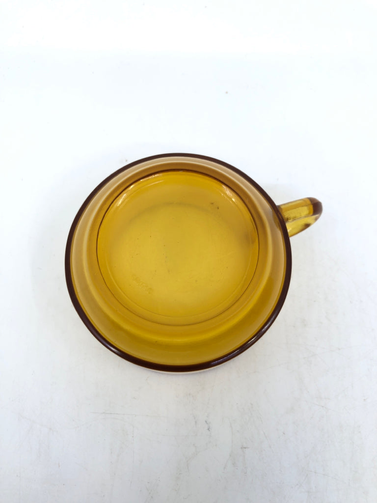 2 AMBER GLASS MUGS AND SAUCERS.