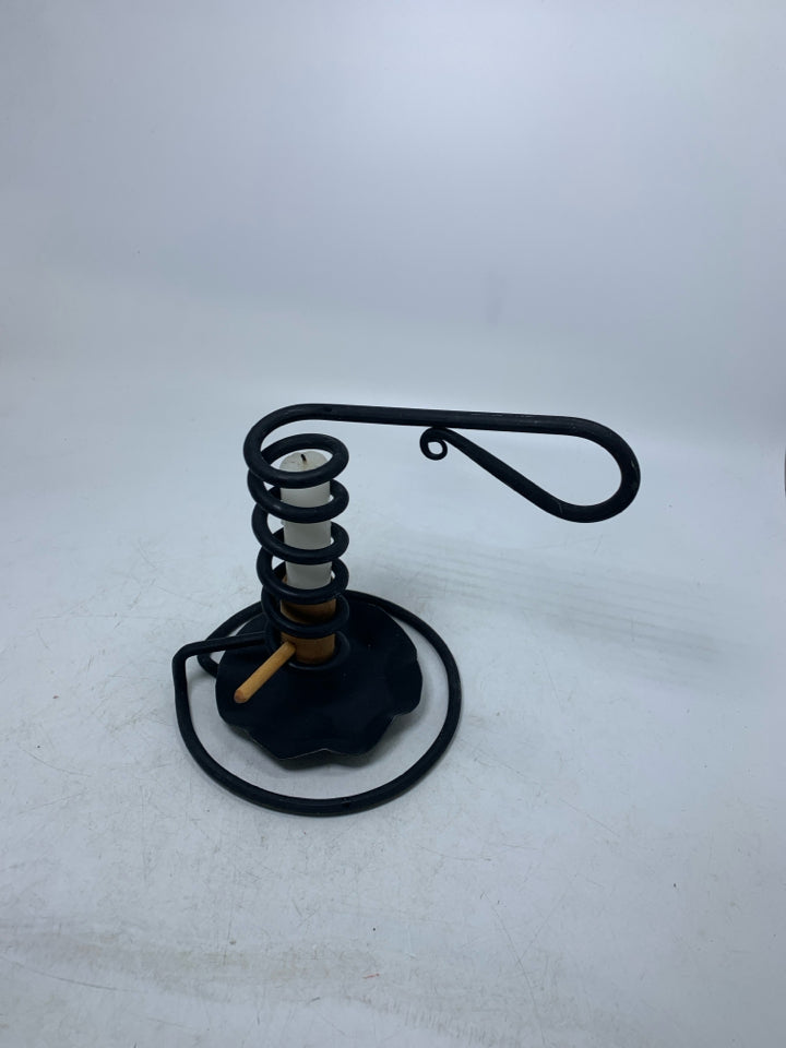 BLACK METAL COIL PRIMITIVE STYLE TAPERED CANDLE HOLDER.