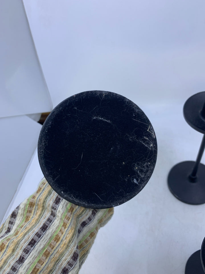 3 BLACK METAL TAPERED CANDLE HOLDERS.