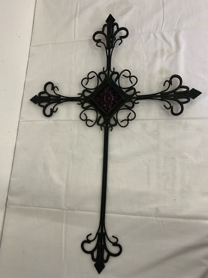 METAL SCROLL CROSS W/PURPLE GLASS IN MIDDLE.