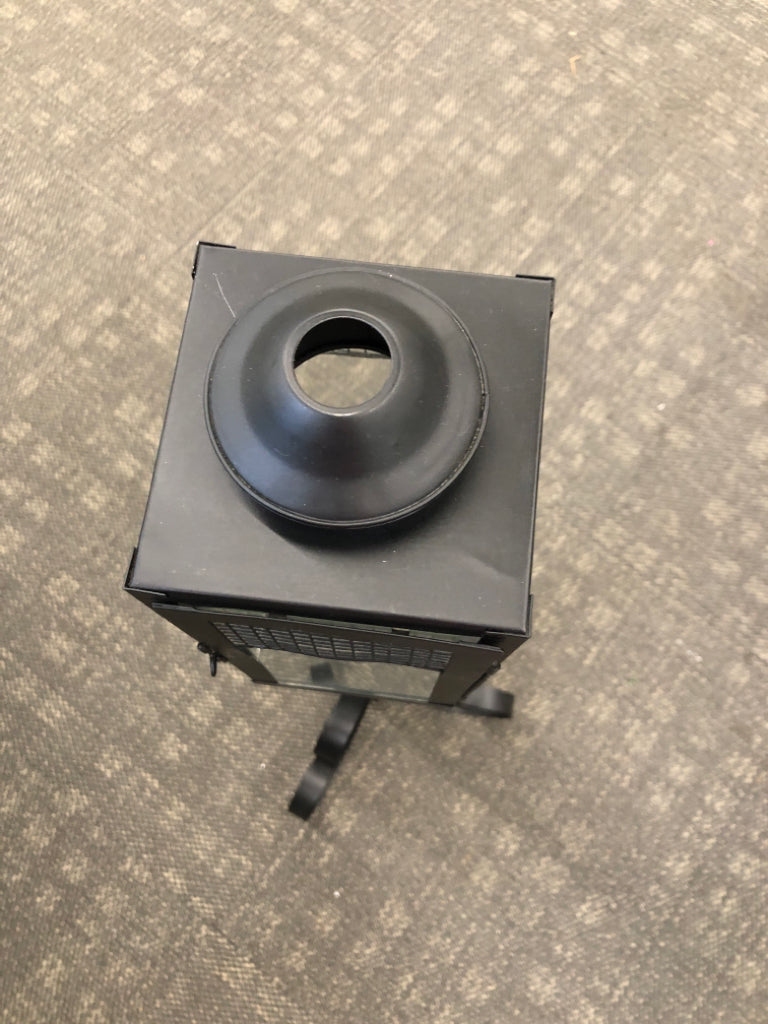 BLACK METAL SCROLL BASE CANDLE LANTERN.