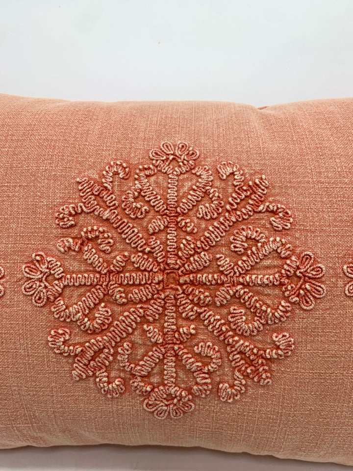 PINK STITCHED STARBURST PILLOW.