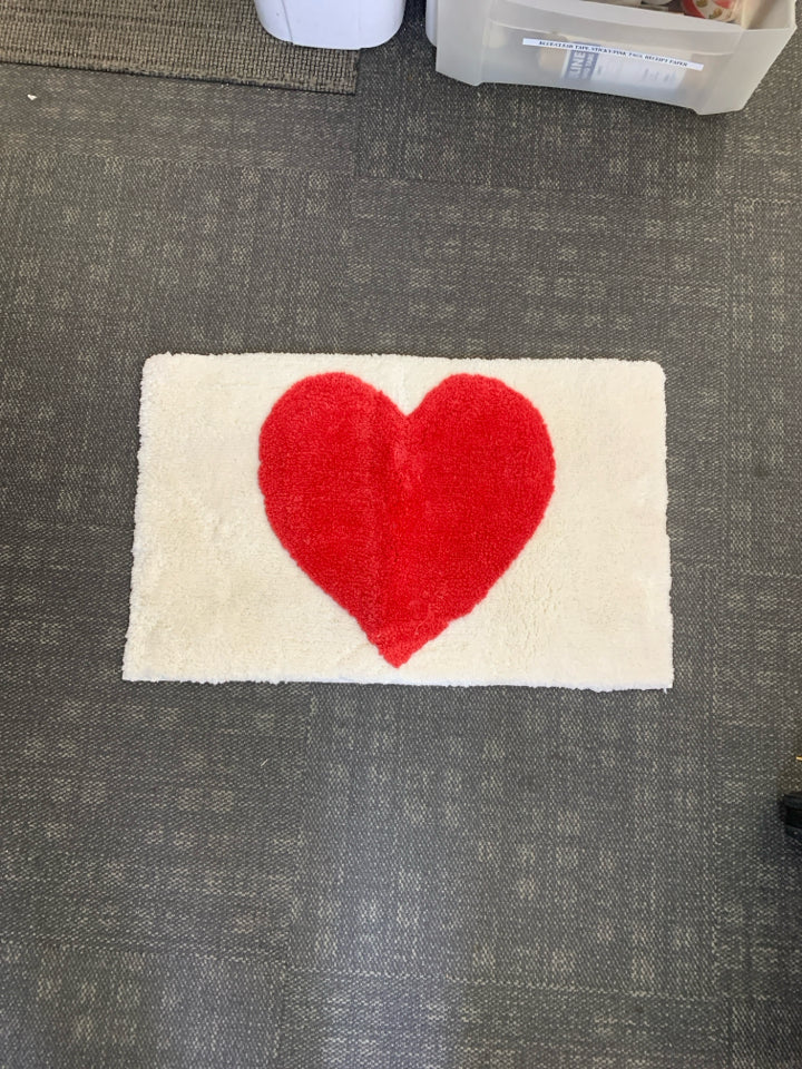 WHITE W RED HEART BATH MAT.