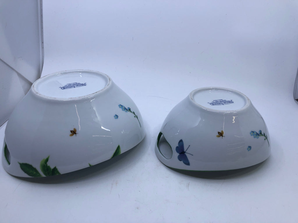 2 NESTING BOWLS W/FRUITS INSECTS WHITE GREEN RIM W/ HANDS.