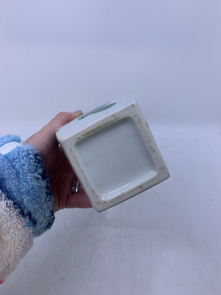 WHITE CERAMIC VASE W/ PAINTED COLORED FLOWERS.