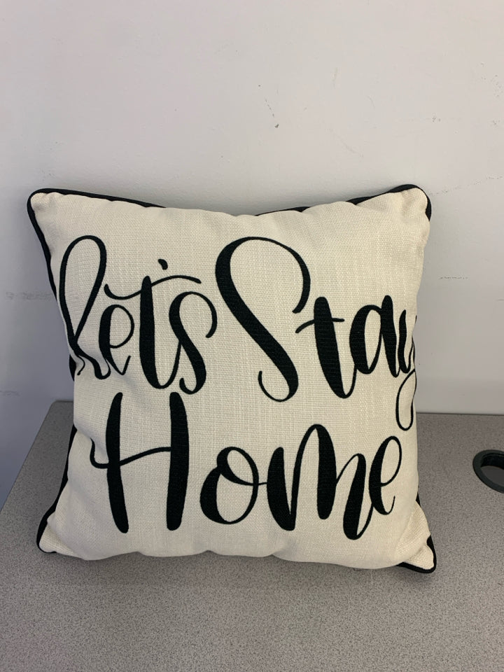 "LET'S STAY HOME" BLACK AND TAN SQUARE PILLOW.