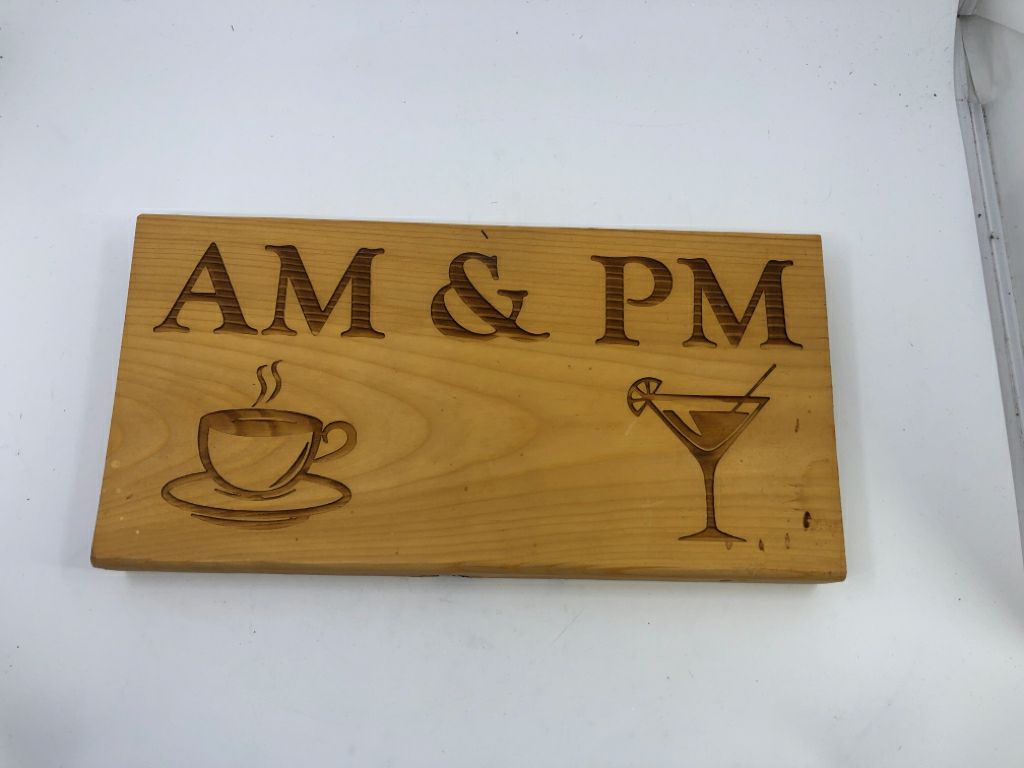 WOOD BLOCK W/ CARVED AM/PM WALL ART.