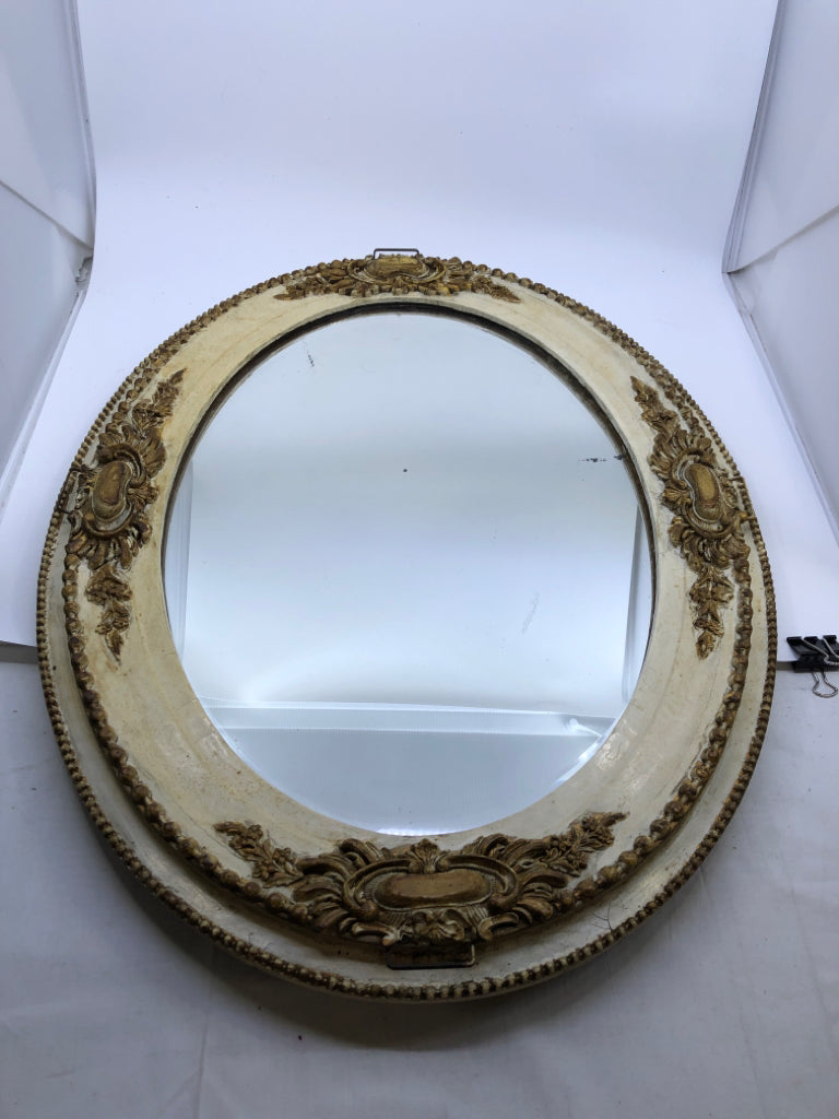 VTG GOLD/CREAM ORNATE OVAL MIRROR.