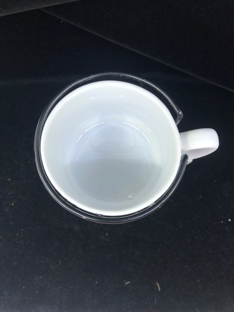 4 STACKED CARDINALS IN BLACK STAND MUGS.