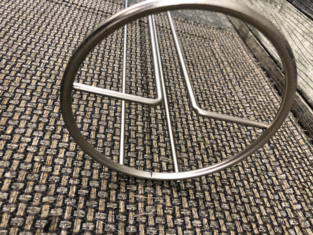 SILVER TOILET PAPER HOLDER.